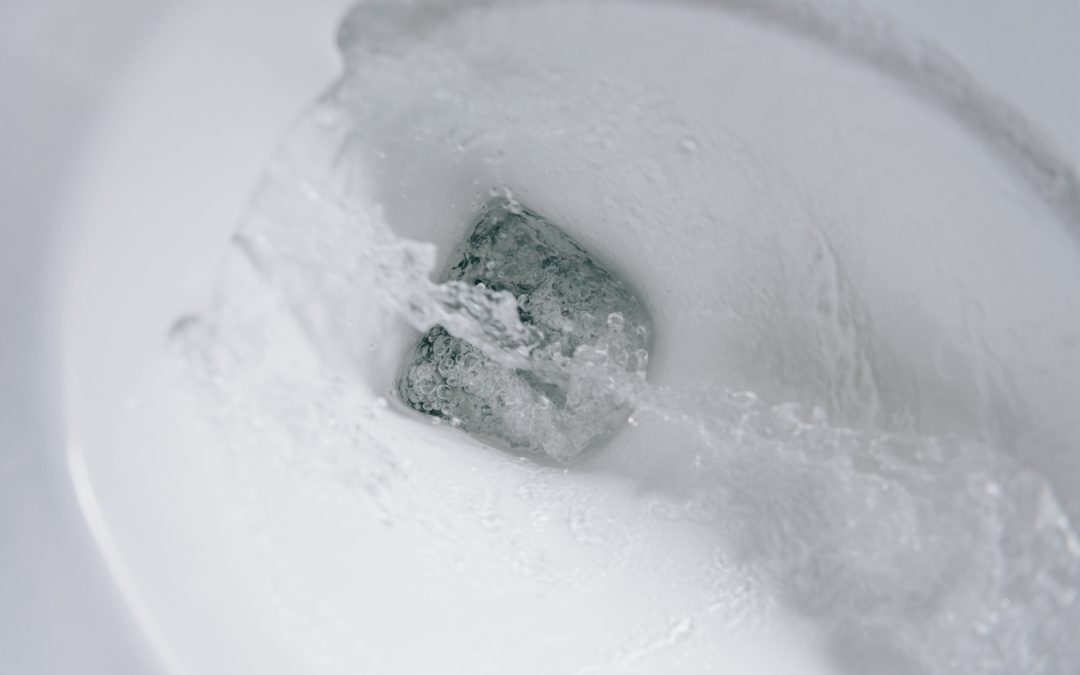 A closeup photo of clean water flushing down a white toilet. There are many items that you should never flush down the toilet. Otherwise, you might need to call a Chesterfield, Virginia plumber for emergency plumbing services.